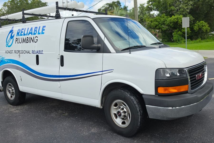 Front three-quarter view of the wrapped plumbing van
