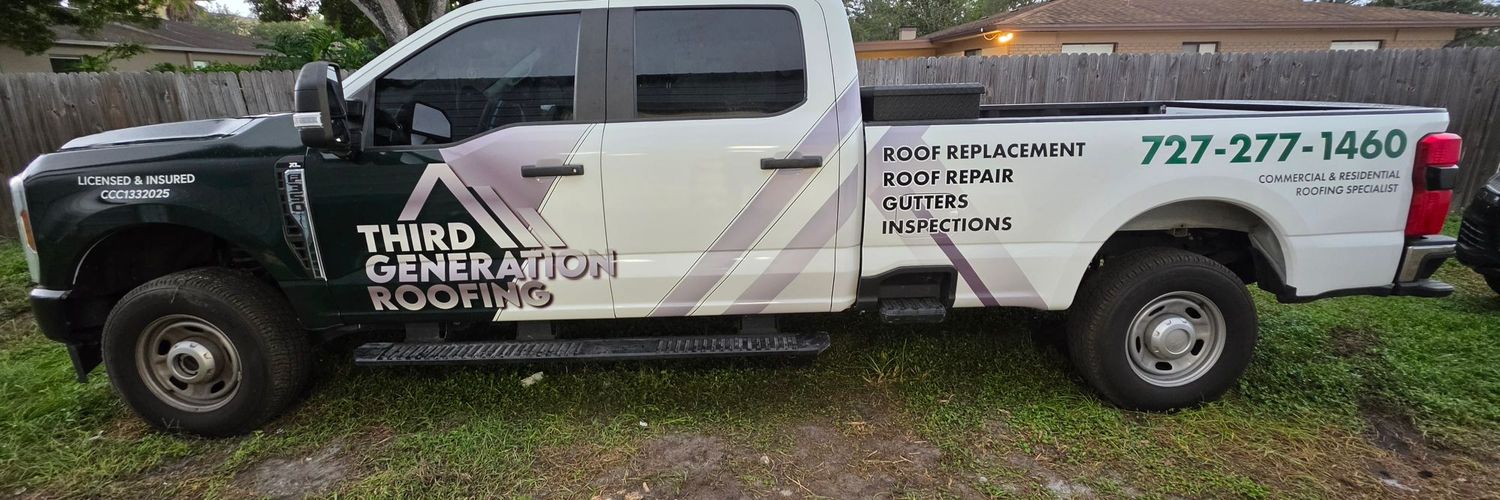 Ford F-350 Super Duty with a full commercial wrap listing roofing services and phone number
